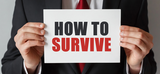 Businessman holding a card with text How to survive